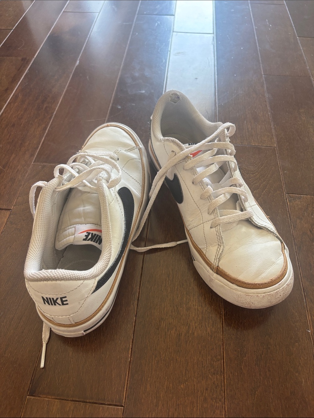 Nike White Sneakers with Black Swoosh and Brown Trim